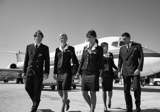 Italy, Sardinia, Olbia International Airport, flight assistants near an airplane @ credit Depositphotos