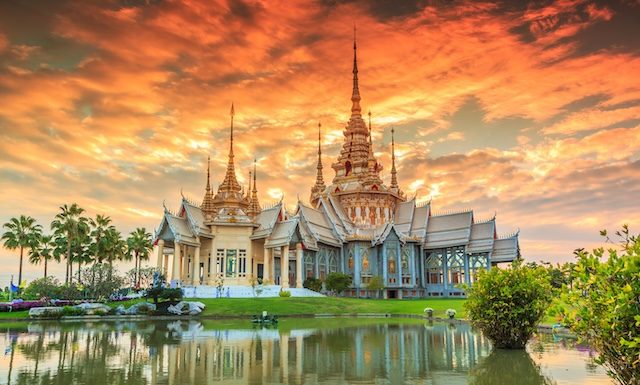 Wat thai, sunset in temple Thailand,They are public domain or treasure of Buddhism @ credit Depositphotos