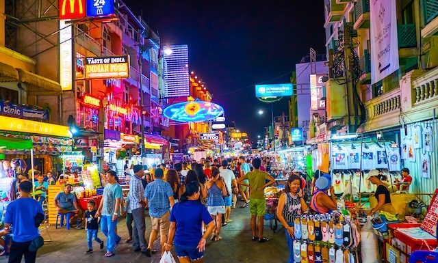 BANGKOK, THAILAND - APRIL 24, 2019: The tourist Khaosan Road is the main all night partying place with numerous bars, shops, hotels and other entertainments for tourists, on April 24 in Bangkok