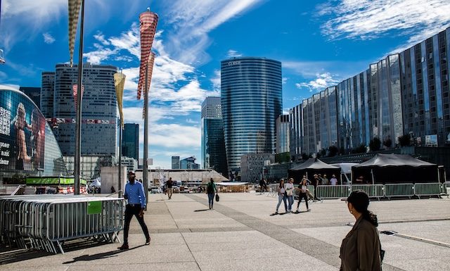 Paris, France - September 12, 2022 Cityscape and architecture of La Defense, a business district located in Greater Paris, skyscrapers surround the famous arch in the center of the esplanade