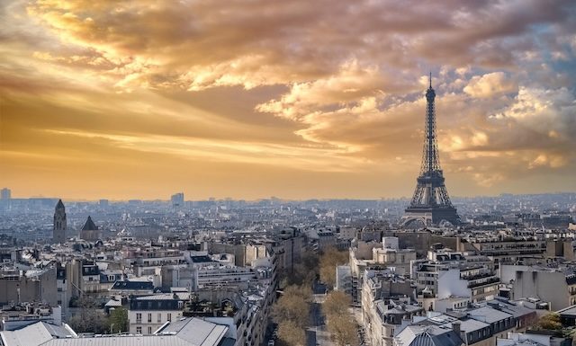 Paris, beautiful Haussmann facades and roofs in a luxury area of the capital, view from the triumph arch, with the Eiffel Tower