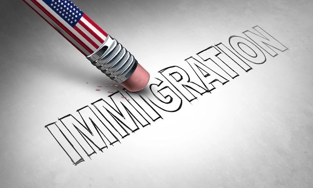 US Immigration Control and United States anti-immigration concept or American immigrant refugee crisis as a symbol of migration being erased with a US flag as a social issue on refugees or illegal immigrant deportation policy.