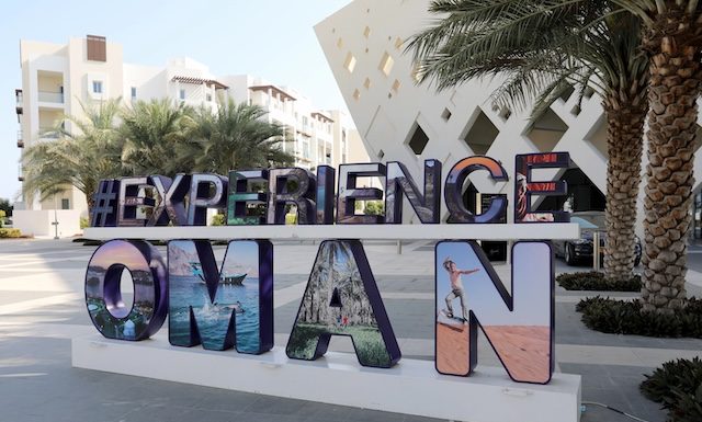 Muscat / Oman – February 11, 2020: Experience Oman sign on display in the Al Mouj (The Wave) district of the Omani capital Muscat