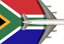 Afrique du Sud | Dissolution du Conseil d’administration de South African Tourism Flag of SOUTH AFRICA with a plane flying over it close up. Vector image.