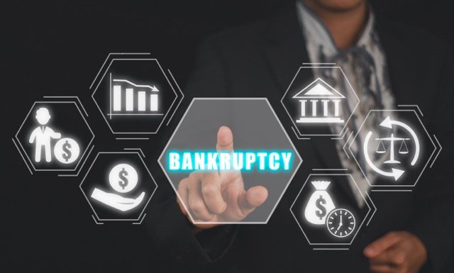 Bankruptcy concept, Business woman hand touching bankruptcy icon on virtual screen.