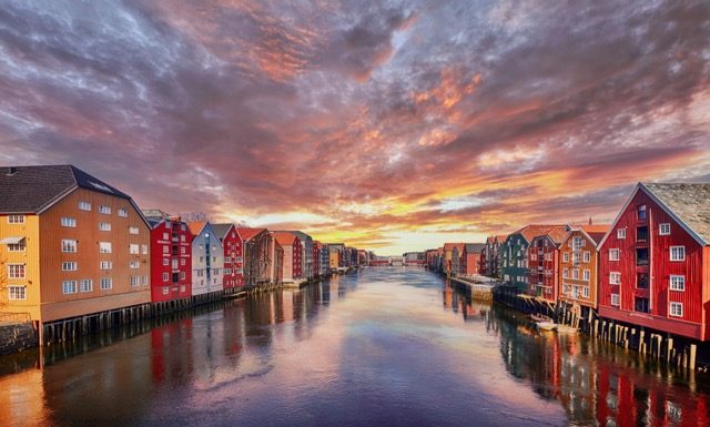 Colorful houses over water in Trondheim city - Norway @ credit Depositphotos