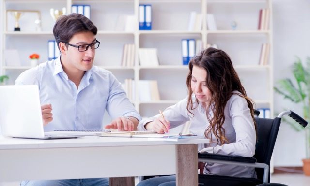 Disabled student studying and preparing for college exams