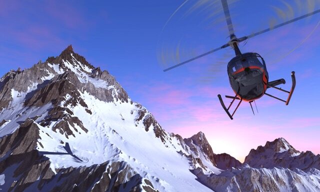Civilian helicopter over the mountains.