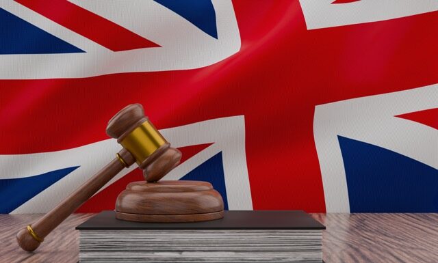 Legal concept with judge mallet and british flag for justice theme.