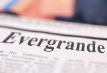 Evergrande written newspaper close up shot to the text.