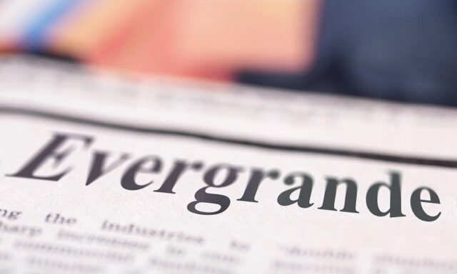 Evergrande written newspaper close up shot to the text.