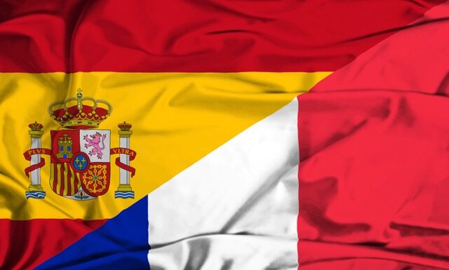 Waving flag of France and Spain