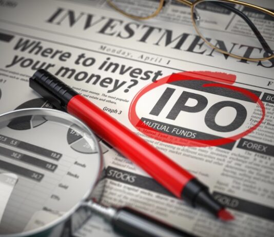 IPO* & résilience | Ennismore, 200 hôtels, une gouvernance réformée et une guerre qui change tout IPO Initial public offering concept. Where to Invest concept, Investments newspaper with loupe and marker.
