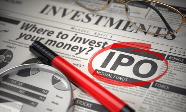 IPO Initial public offering concept. Where to Invest concept, Investments newspaper with loupe and marker.