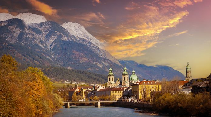 Panoramic view of sunset scene at Innsbruck cityscape, colorful historic buildings in Innsbruck, Austria