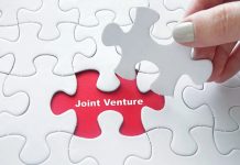 Corée du Sud | Shinsegae et OKO Group s’associent pour un fonds de 500 millions de dollars dédié à Aman Close up of girl's hand placing the last jigsaw puzzle piece with Joint Venture