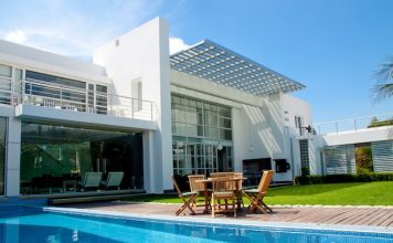 luxury home with a garden and swimming pool @ depositphotos.com