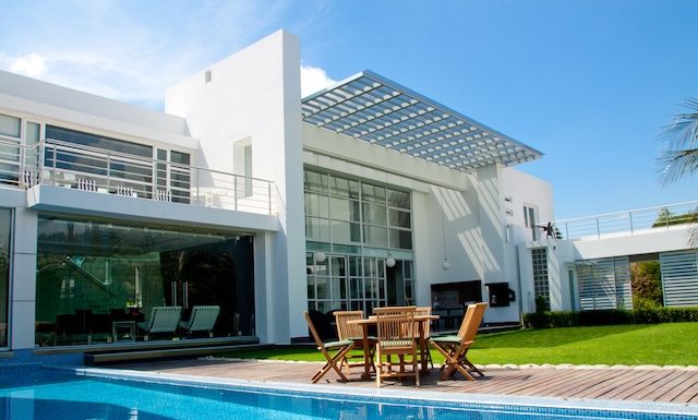 luxury home with a garden and swimming pool @ depositphotos.com
