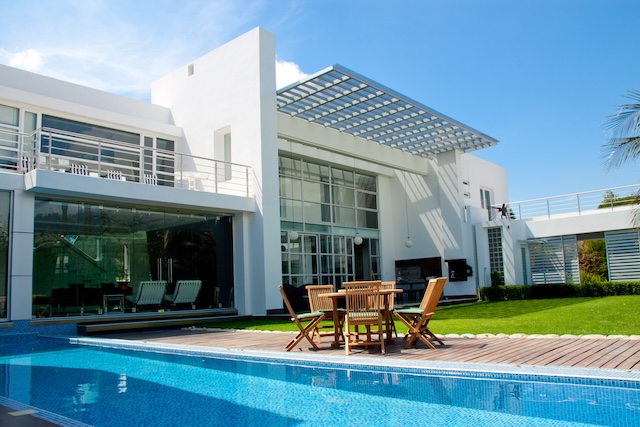 luxury home with a garden and swimming pool luxury home with a garden and swimming pool @ depositphotos.com