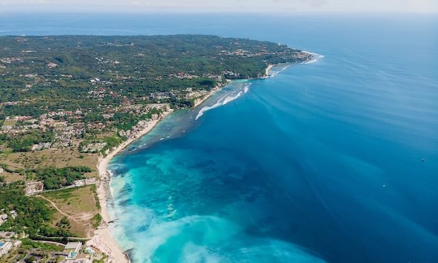 Aerial view of Bukit peninsula with blue ocean in Bali
