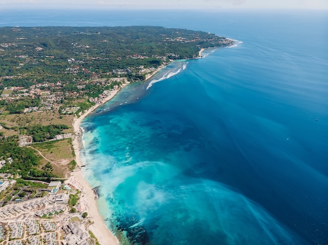 Aerial view of Bukit peninsula with blue ocean in Bali