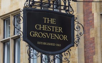 Chester, UK - August 1st 2018: A sign above the entrance to the Chester Grosvenor Hotel in the historic city of Chester, UK. The hotel is owned by the Duke of Westminster.