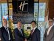 2029, Hongrie | IHG signe un Holiday Inn Express & Suites à Debrecen, sa première adresse dans l’est du pays Representatives celebrate the signing of a new Holiday Inn Express project. Left to right: Csukás Endre (Director at Xanga Investment and Development Group), István Herdon (Chief Executive Officer at Xanga Investment and Development Group), Farkhad Kamilov (Development Project Manager, Northern Europe, IHG Hotels & Resors, Bruno Sousa (Director of Design, EMEAA, IHG Hotels & Resorts)